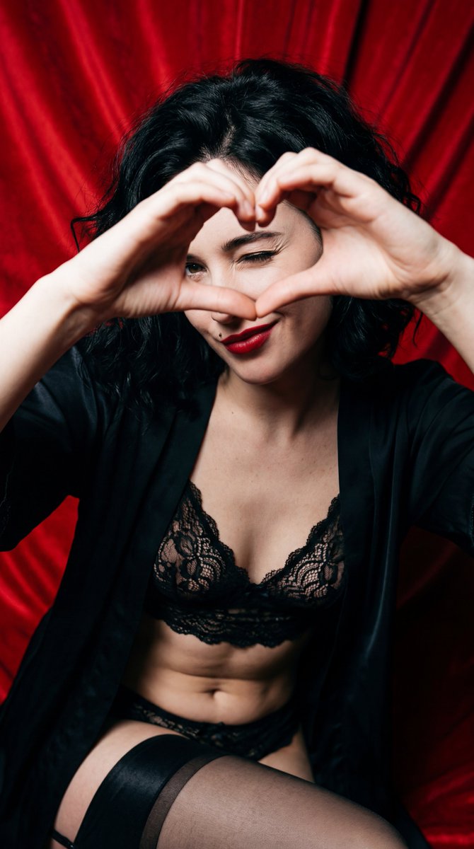 Subject: A young woman with wavy, tousled jet black hair. She...