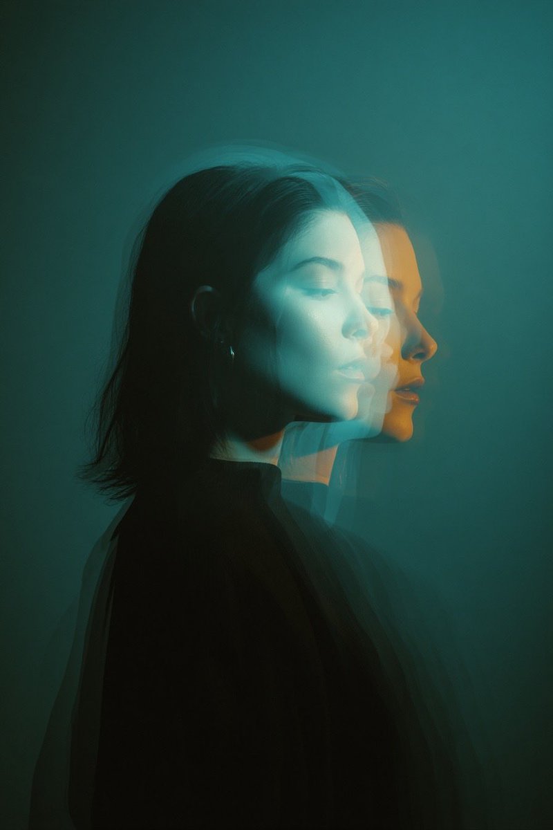 Cinematic double exposure portrait of a woman in side profile...